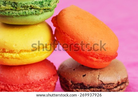 Colorful macaroons on bright pink