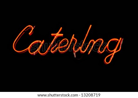 Glowing Orange Neon Sign Which Reads Catering