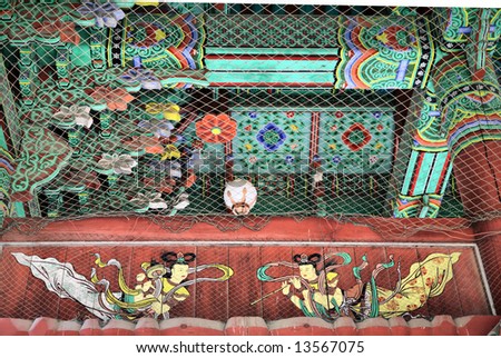 Ancient Painting of Twin Angels on Wooden Buddhist Temple Arch