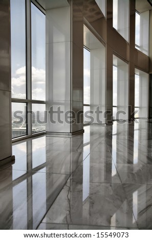 Editorial Use Only: Tall Marble Interior with Office Windows Looking out over Downtown Houston