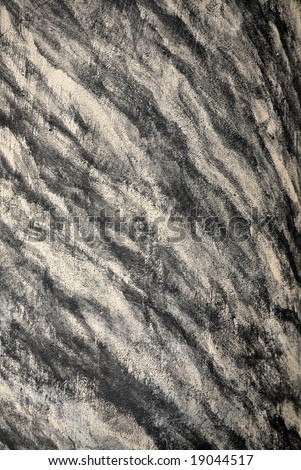 Black, grey, and white striated streaks in marble granite block