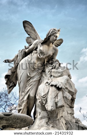 Editorial: Heavenly Angel Sculpture against Deep Blue Sky