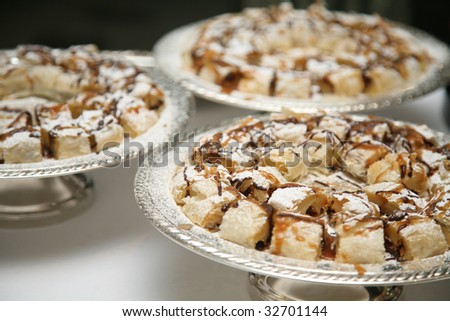 Three Silver Platters Filled with Banana Cake Finger Food