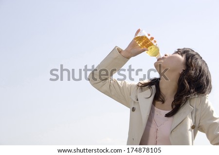 Japanese Woman drinking soda