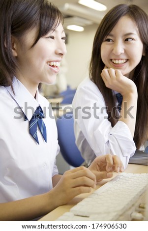 Female Japanese students laughing together