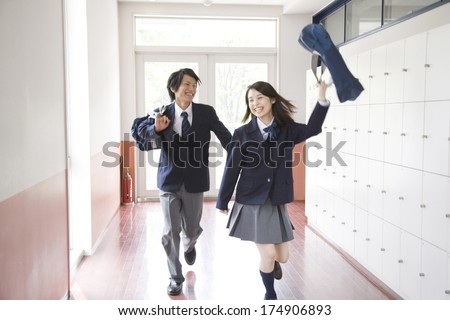 Japanese students walking down hallway
