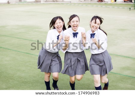 female Japanese students laughing together