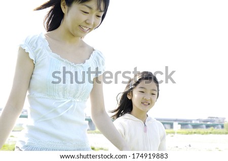 Japanese mother and daughter outside