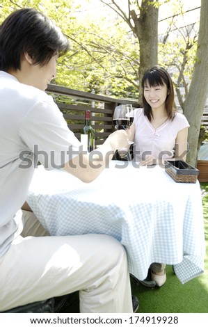 Japanese couple having toasting wine