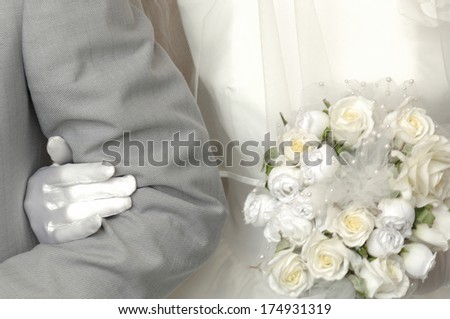 Bride grabbing the arm of the groom