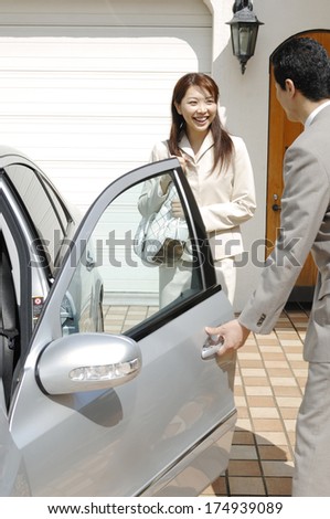 Japanese lady getting into a car