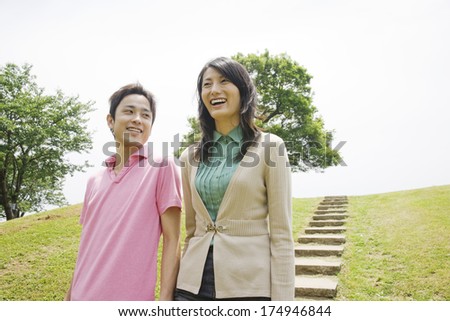 Japanese Couple walking down the stairs of the park