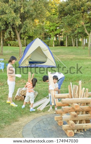 Japanese Family carrying firewood for campfire