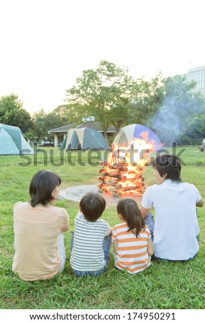Rear View of Japanese family seeing the campfire