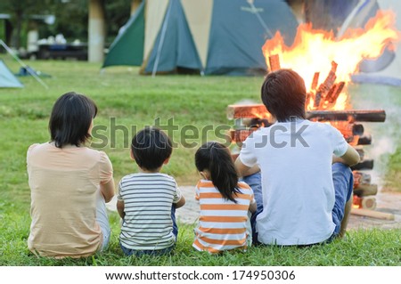 Rear View of Japanese family seeing the campfire