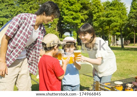 Japanese Family drinking at a barbecue party