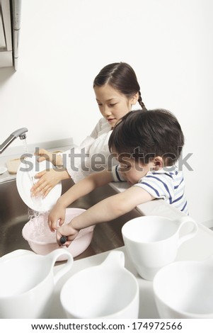 Japanese Siblings help do the dishes