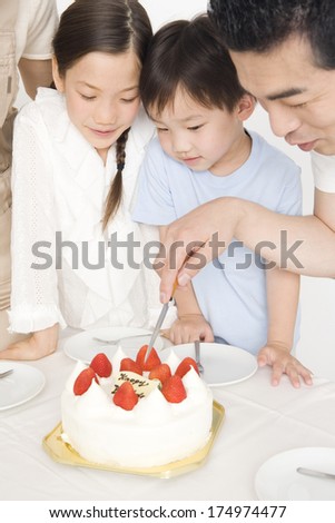Japanese Father sharing the cake