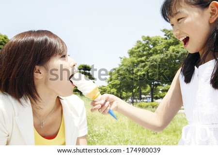 Japanese Girl giving the ice cream to the mother