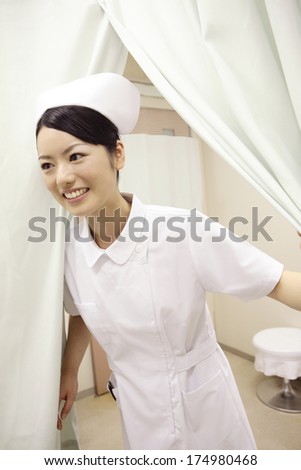 Japanese Nurse opening the curtain