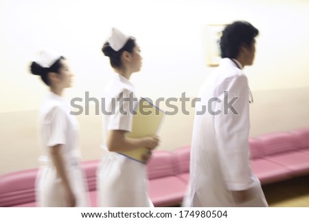 Japanese Doctors and nurses walking down the hall