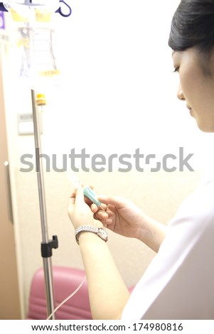 Japanese Nurse to perform a visual acuity test