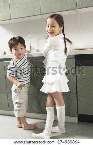Japanese Children helping do the dishes