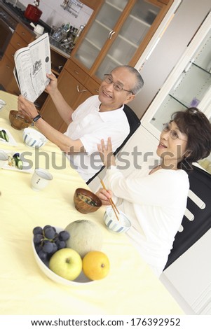 Japanese senior couple eating breakfast