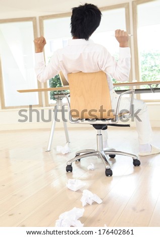 Back of a Japanese Business couple businessman stretching out