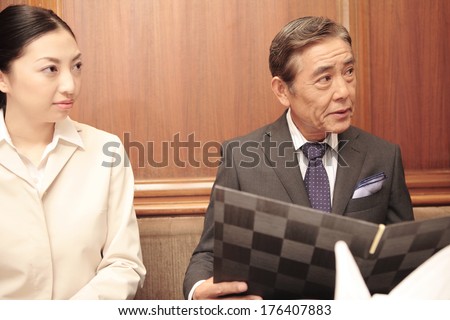 Japanese Secretary and president order food at restaurant