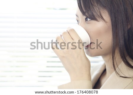 Japanese Office lady drinking water