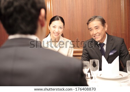 Secretary and CEO of company eating out in restaurant