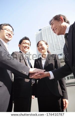 Businessmen and woman meeting