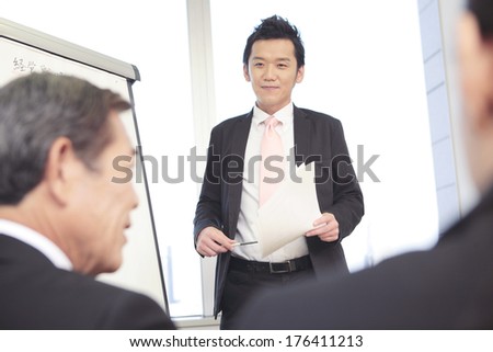 Japanese businessman makes a presentation