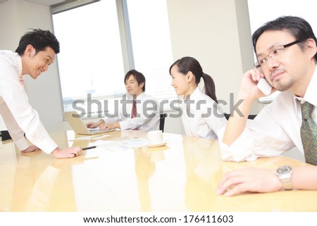 Japanese colleagues meet in a conference room