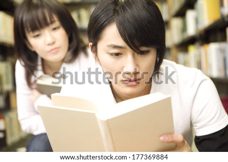 Japanese Students reading a book