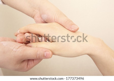 Japanese woman taking a hand care
