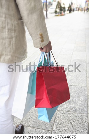 Hand of Japanese man with a shopping bag