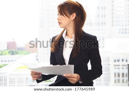 Japanese Office Lady with a material