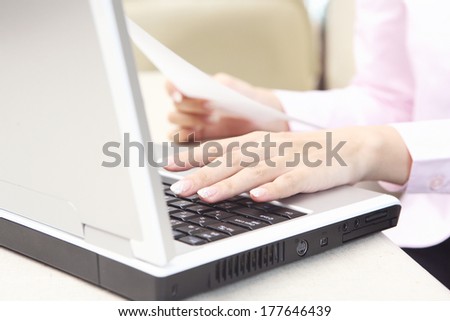 Hand of Japanese Office Lady typing the keyboard of the laptop