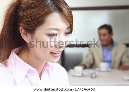 Japanese female office worker in the meeting in a cafe