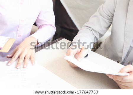 Japanese office lady and businessman in the meeting