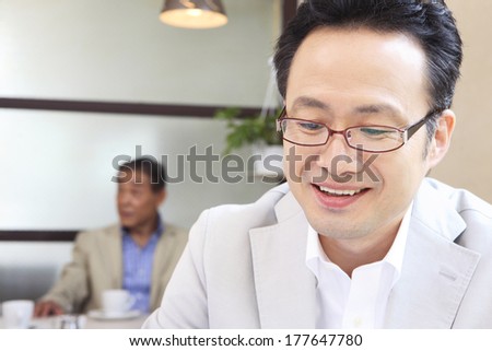 Japanese Businessman in the meeting in a cafe