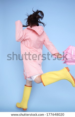 Japanese woman to jump wearing rain gear