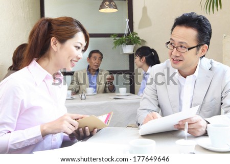 Japanese office lady and businessman in the meeting