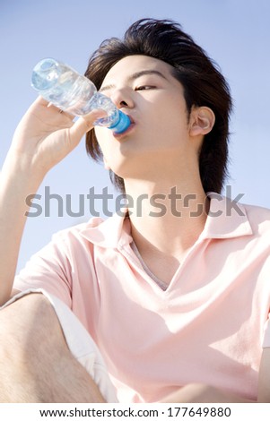 Japanese man drinking lemonade