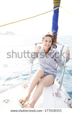 Japanese woman siting in front of the yacht