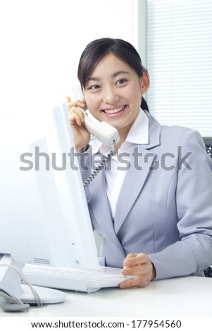 Japanese businesswoman having a telephone conversation