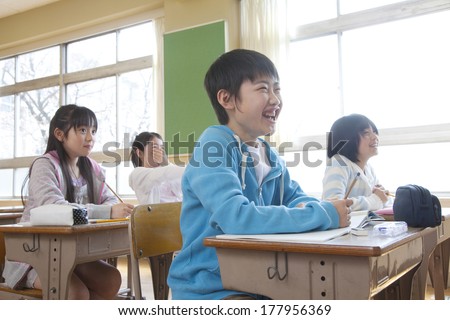 Primary Japanese boy and Japanese girl who take a class