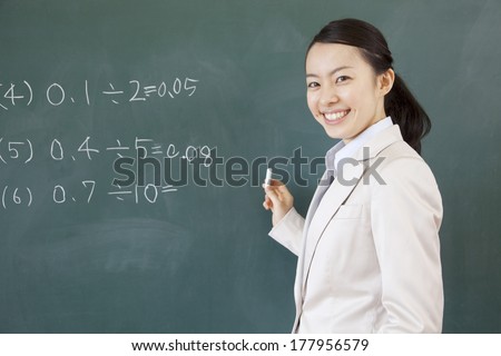 Japanese Teacher who Writes the math problem on the blackboard